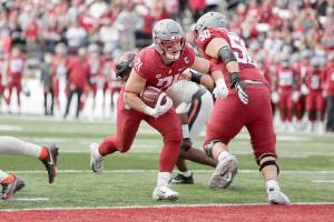 Washington State running back Max Borghi (21) runs for a touchdown during the second half of an NCAA college football game against Oregon State, Saturday, Oct. 9, 2021, in Pullman, Wash. Washington State won 31-24. (AP Photo/Young Kwak)