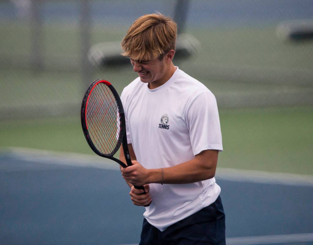 Glacier Peaks Nathan Simicich reacts to returning a volley out of bounds during a double match against Kamiak at Glacier Peak High School on Tuesday, Oct. 12, 2021 in Snohomish, Wa. (Olivia Vanni / The Herald)