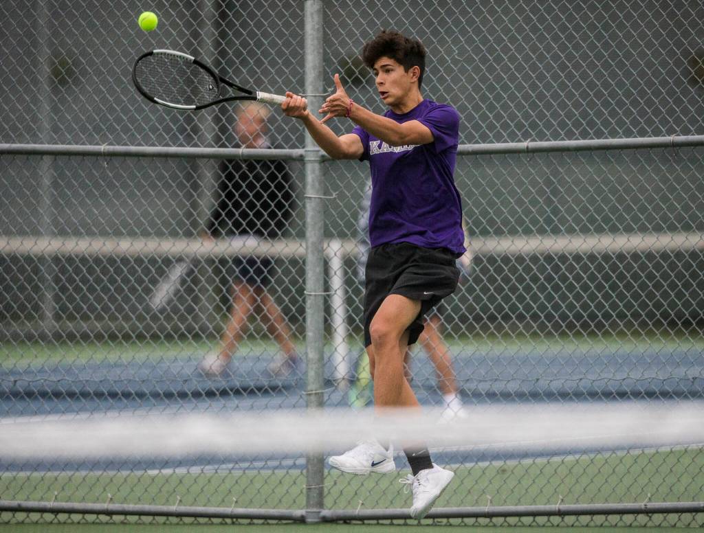 Kamiaks Zach Boonsripisal returns a volley during a doubles match against Glacier Peak at Glacier Peak High School on Tuesday, Oct. 12, 2021 in Snohomish, Wa. (Olivia Vanni / The Herald)