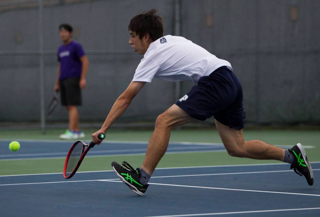 Glacier Peaks Jason Yee returns a volley during a match against Kamiaks Josh Kim at Glacier Peak High School on Tuesday, Oct. 12, 2021 in Snohomish, Wa. (Olivia Vanni / The Herald)