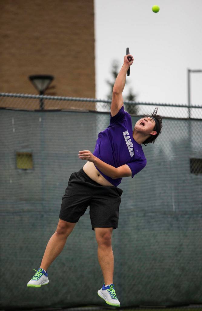Aaron Lee serves the ball during a match against Glacier Peaks Jackson Stumpf at Glacier Peak High School on Tuesday, Oct. 12, 2021 in Snohomish, Wa. (Olivia Vanni / The Herald)