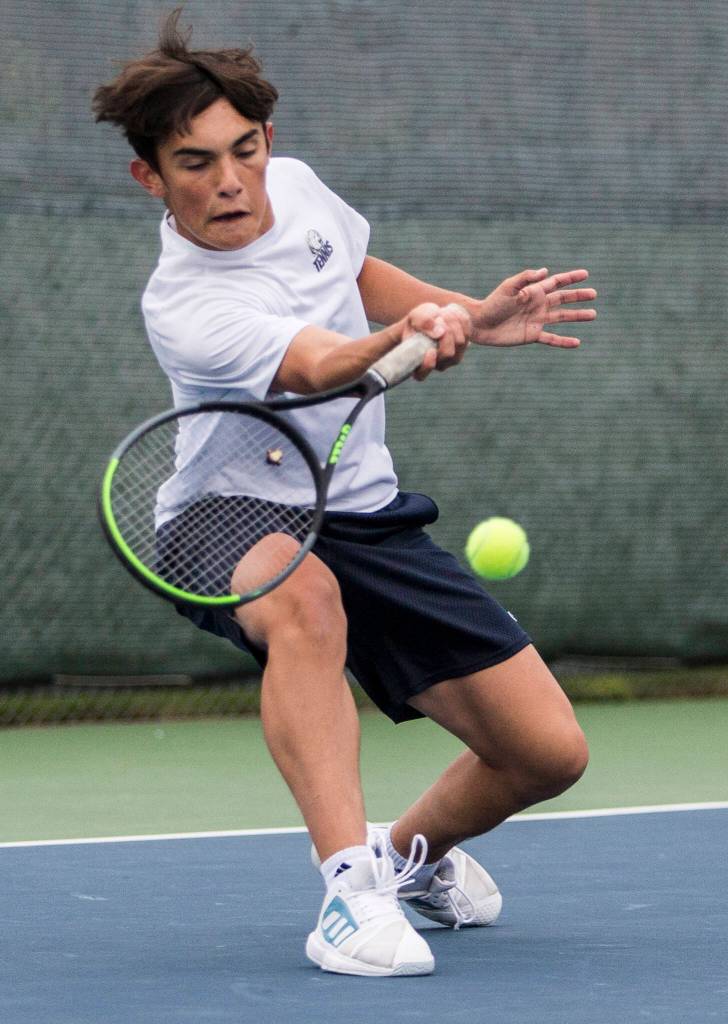 Glacier Peaks Jackson Stumpf returns a volley during a match at Glacier Peak High School on Tuesday, Oct. 12, 2021 in Snohomish, Wa. (Olivia Vanni / The Herald)
