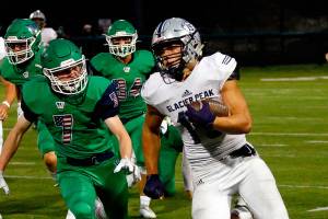 Glacier Peak's Trey Leckner rushes for a touchdown Thursday evening at Pop Keeney Stadium in Bothell on September 16, 2021. (Kevin Clark / The Herald)