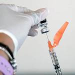 A nurse loads a syringe with the Pfizer COVID-19 vaccine in Jackson, Miss. (AP Photo/Rogelio V. Solis)