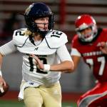 Arlington's Trent Nobach scrambles against Stanwood Friday night at Stanwood High School on September 24, 2021.  (Kevin Clark / The Herald)