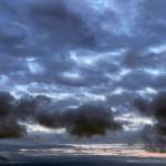 Clouds hover over the waters off Everett's western edge Monday morning. (Sue Misao / The Herald)