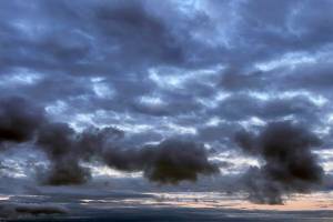 Clouds hover over the waters off Everett's western edge Monday morning. (Sue Misao / The Herald)