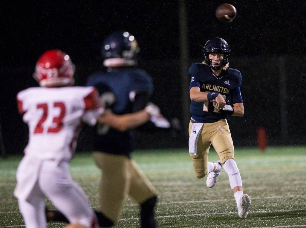 Trent Nobach threw for 245 yards and two touchdowns to lead Arlingtons fast-paced aerial attack. (Olivia Vanni / The Herald)