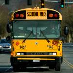 A school bus waits at an intersection in Issaquah, east of Seattle, on Feb. 24, 2021. (AP Photo/Ted S. Warren)