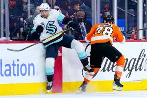 Seattle Kraken's Jordan Eberle, left, and Philadelphia Flyers' Claude Giroux collide during the first period of an NHL hockey game, Monday, Oct. 18, 2021, in Philadelphia. (AP Photo/Matt Slocum)
