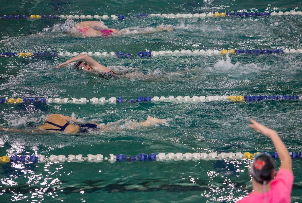 Snohomishs Macky Blackwell takes a breath while a teammate cheers her on during the 200 Yard Freestyle on Tuesday, Oct. 19, 2021 in Snohomish, Wa. (Olivia Vanni / The Herald)