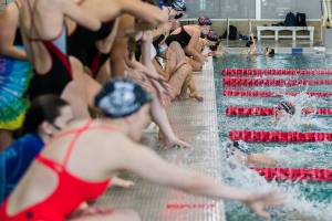 Glacier Peak and Snohomish swimmers cheer on their teammates on Tuesday, Oct. 19, 2021 in Snohomish, Wa. (Olivia Vanni / The Herald)