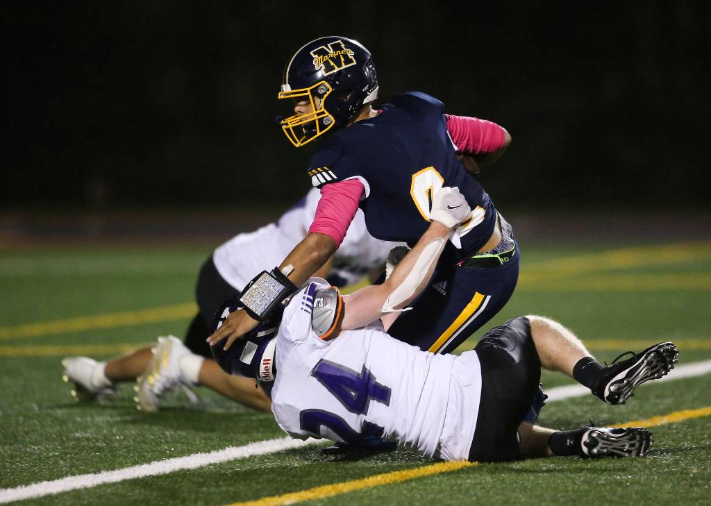 Mariners Damien Bagley goes down just before being tackled in the end zone as Kamiak beat Mariner 41-14 in a football game at Goddard Stadium on Tuesday, Oct. 19, 2021 in Everett, Washington. (Andy Bronson / The Herald)