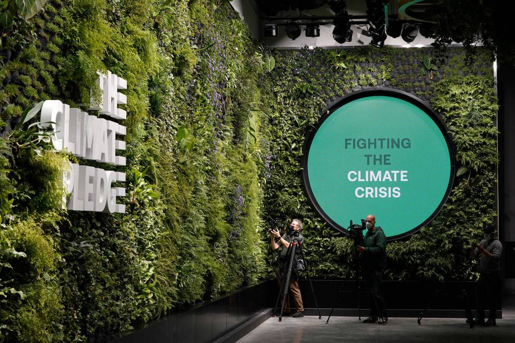 Photographers film the living wall inside Climate Pledge Arena on Wednesday during a media tour ahead of the Seattle Krakens home opener Saturday against the Vancouver Canucks in Seattle. (AP Photo/Ted S. Warren)