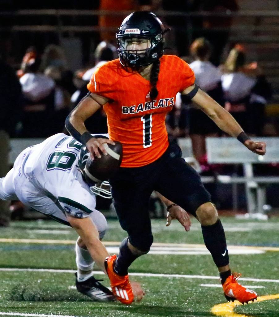 While splitting snaps at quarterback this season, Leggett has provided a dual-threat skill set as both a passer and runner. (Kevin Clark / The Herald)