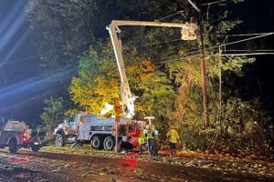 A Snohomish County PUD crew works to restore power in Mountlake Terrace on Sunday night. (Snohomish County PUD)