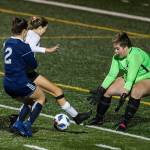 Jacksons Abigail Harper comes out to stop a shot during the game Tuesday in Snohomish. (Olivia Vanni / The Herald)
