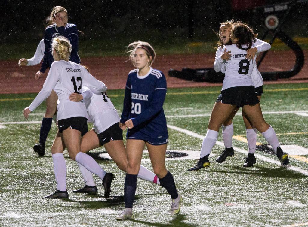 Jackson players celebrate their victory after the final whistle is blown. (Olivia Vanni / The Herald)