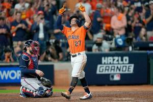 Houston Astros' Jose Altuve celebrates after a home run during the seventh inning in Game 2 of baseball's World Series between the Houston Astros and the Atlanta Braves Wednesday, Oct. 27, 2021, in Houston. (AP Photo/David J. Phillip)