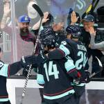 Kraken players celebrate after Haydn Fleury scored against the Wild during the second period of a game Thursday in Seattle. (AP Photo/Ted S. Warren)
