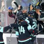 Seattle Kraken players celebrate after Haydn Fleury scored against the Minnesota Wild during the second period of an NHL hockey game, Thursday, Oct. 28, 2021, in Seattle. (AP Photo/Ted S. Warren)