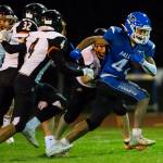 South Whidbeys Cole Tschetter escapes multiple tackles during the game against Granite Falls on Friday, Oct. 29, 2021 in Langley, Wa. (Olivia Vanni / The Herald)