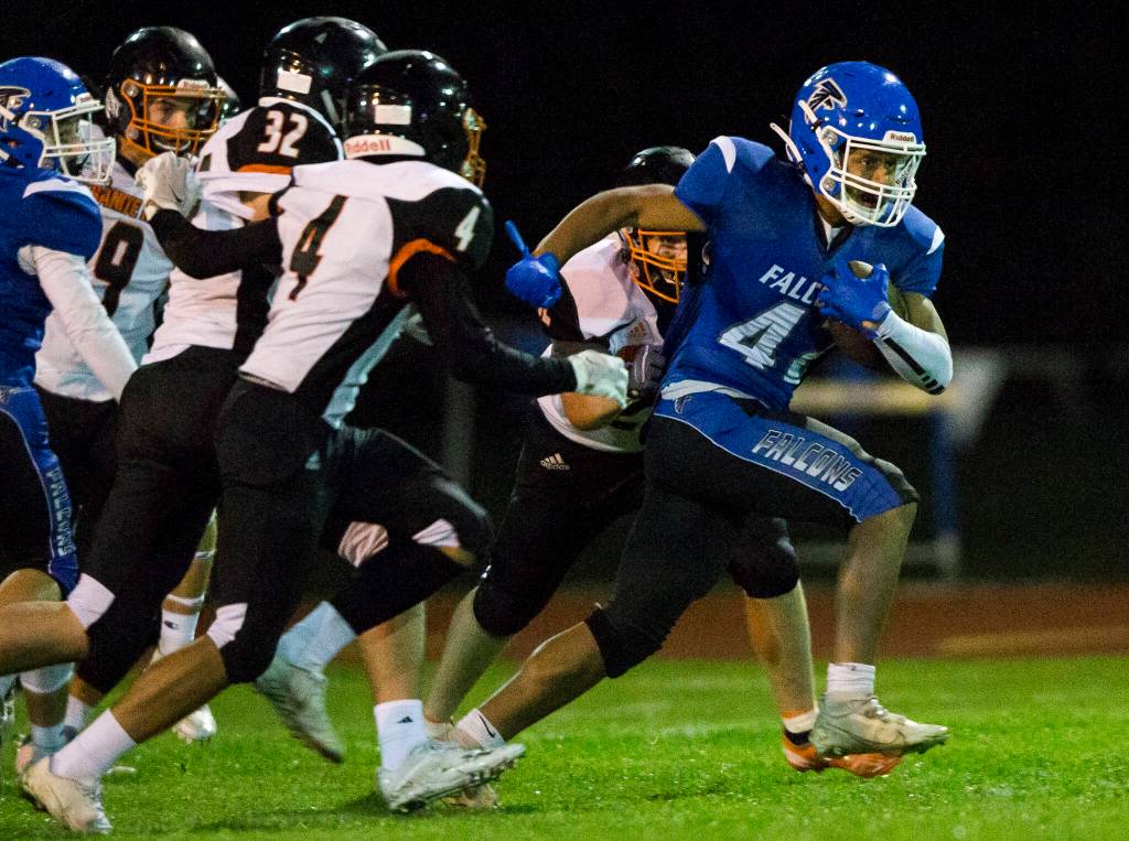 South Whidbeys Cole Tschetter escapes multiple tackles during the game against Granite Falls on Friday, Oct. 29, 2021 in Langley, Wa. (Olivia Vanni / The Herald)