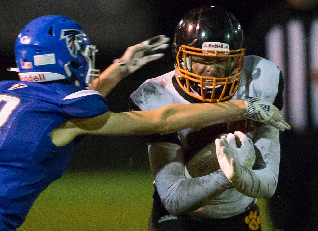 Granite Falls Gio Gonzalez is tackled during the game against South Whidbey on Friday, Oct. 29, 2021 in Langley, Wa. (Olivia Vanni / The Herald)