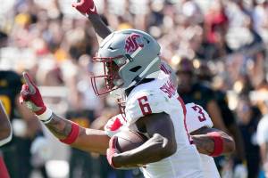 Washington State defensive back Chau Smith-Wade (6) celebrates his interception against Arizona State during the first half of an NCAA college football game, Saturday, Oct 30, 2021, in Tempe, Ariz. (AP Photo/Darryl Webb)