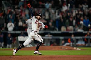 Atlanta Braves' Dansby Swanson celebrates his home run during the seventh inning in Game 4 of baseball's World Series between the Houston Astros and the Atlanta Braves Saturday, Oct. 30, 2021, in Atlanta. (AP Photo/David J. Phillip)