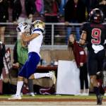 Washington wide receiver Jalen McMillan (left) catches a touchdown pass against Stanford during the waning moments of the fourth quarter of a game Saturday night in Stanford, Calif. Washington won 20-13. (AP Photo/John Hefti)