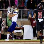 Washington wide receiver Jalen McMillan, left, catches a touchdown pass against Stanford during the fourth quarter of an NCAA college football game in Stanford, Calif., Saturday, Oct. 30, 2021. Washington won 20-13. (AP Photo/John Hefti)