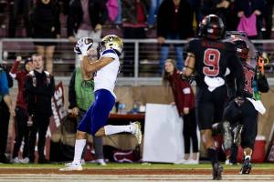 Washington wide receiver Jalen McMillan, left, catches a touchdown pass against Stanford during the fourth quarter of an NCAA college football game in Stanford, Calif., Saturday, Oct. 30, 2021. Washington won 20-13. (AP Photo/John Hefti)