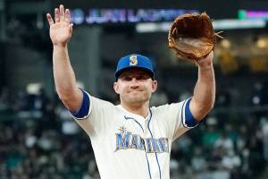 Seattle Mariners third baseman Kyle Seager reacts to the crowd chanting his name before being subbed out of a baseball game against the Los Angeles Angels during the ninth inning, Sunday, Oct. 3, 2021, in Seattle. (AP Photo/Ted S. Warren)