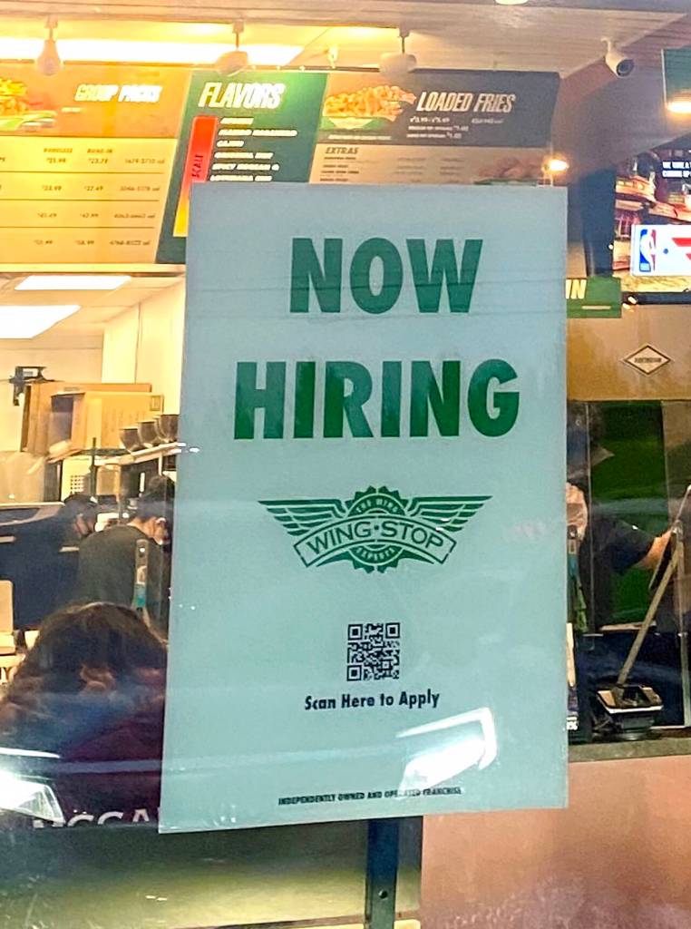 Sign in the window of the Wingstop Restaurant at 8417 Evergreen Way in Everett. (The Herald)