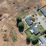 A group is suing the Army Corps of Engineers, alleging the planned construction of a Costco warehouse in Lake Stevens will violate the Clean Water Act. This Aug. 10 aerial photo was taken after thousands of trees were removed near homes at the end of the 2100 block of 93rd Drive SE. (Chuck Taylor / Herald file)