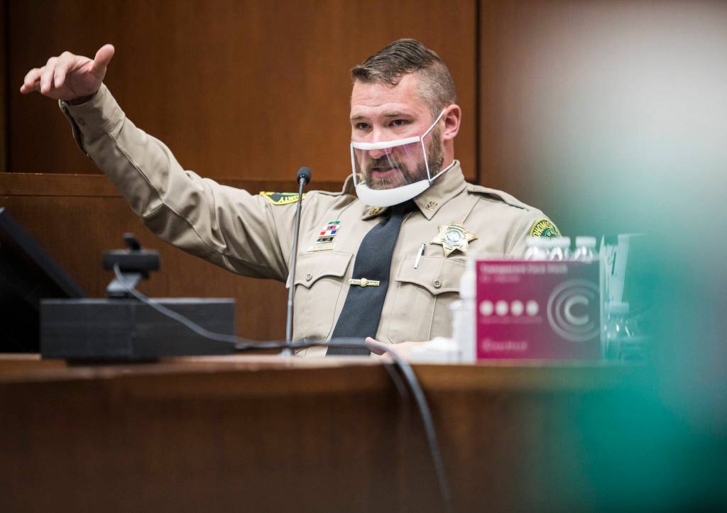 Sheriffs Deputy Art Wallin testifies during the trial of Kevin Lewis on Wednesday in Everett. (Olivia Vanni / The Herald)