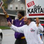 Snohomish Mayor John Kartak gives a thumbsup sign as he and supporters wave signs along 2nd Street on Monday in Snohomish. (Andy Bronson / The Herald)