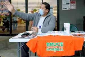 Bruce Harrell, who is running against Lorena Gonzalez in the race for Mayor of Seattle, campaigns Tuesday, Nov. 2, 2021, on Election Day at a grocery store in South Seattle. (AP Photo/Ted S. Warren)