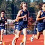 Brandon Moore (36), Aiden Emerson (39) and Kiyoshi Hall (35) have helped lead the Arlington boys cross country team to another dominant season that has them dreaming big heading into Saturdays state championships. (Kevin Clark / The Herald)
