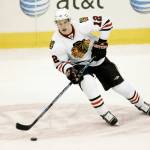 The Blackhawks Kyle Beach controls the puck in the first period of a preseason game against the Stars on Oct. 2, 2008, in Dallas. (AP Photo/Tony Gutierrez)