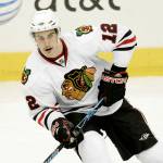 Chicago Blackhawks Kyle Beach (12) controls the puck in the first period of a preseason NHL hockey game against the Dallas Stars, Thursday, Oct. 2, 2008, in Dallas. (AP Photo/Tony Gutierrez)
