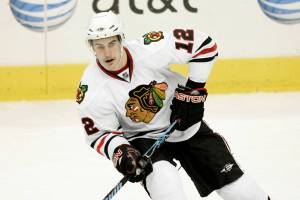 Chicago Blackhawks Kyle Beach (12) controls the puck in the first period of a preseason NHL hockey game against the Dallas Stars, Thursday, Oct. 2, 2008, in Dallas. (AP Photo/Tony Gutierrez)