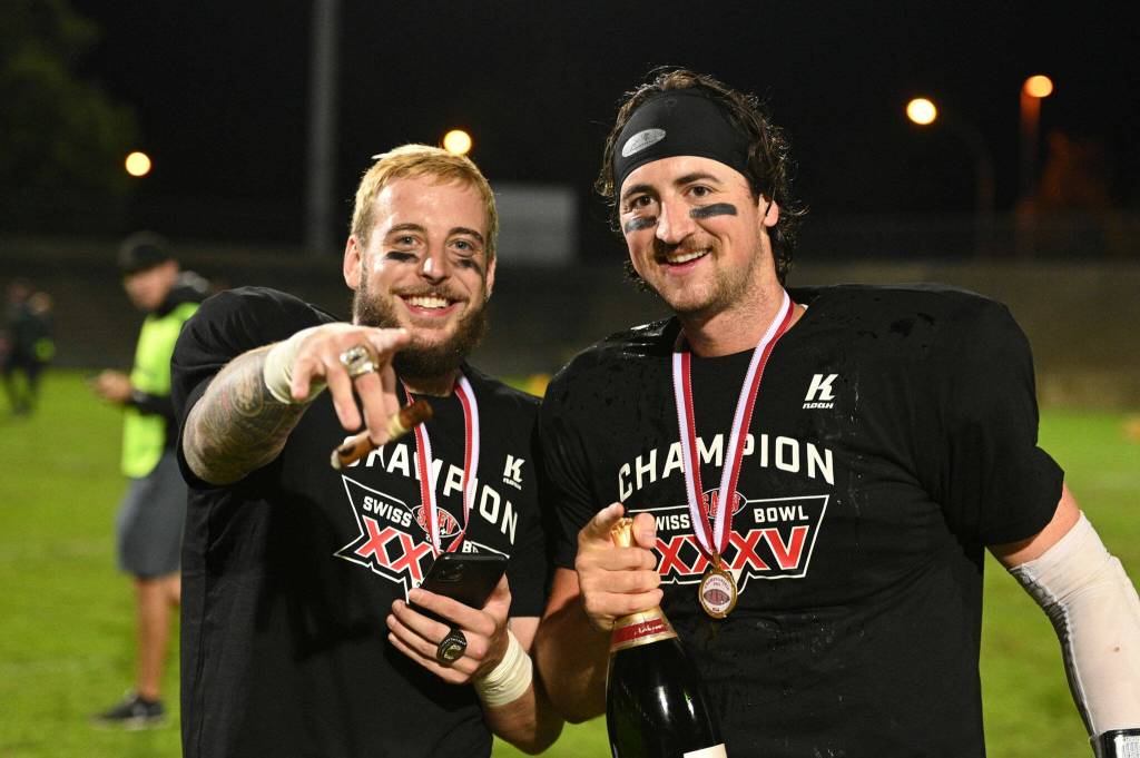 Arlington High School graduate Max Gray (left) and Calanda Broncos teammate Conner Manning celebrate their Swiss Bowl victory. (Sergio Brunetti / Stockpix.it)