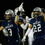 Glacier Peaks Ashton Olson and Reggie Valmonte signal a turnover against Skyline Friday night at Veterans Memorial Stadium in Snohomish on November 5, 2021. (Kevin Clark / The Herald)