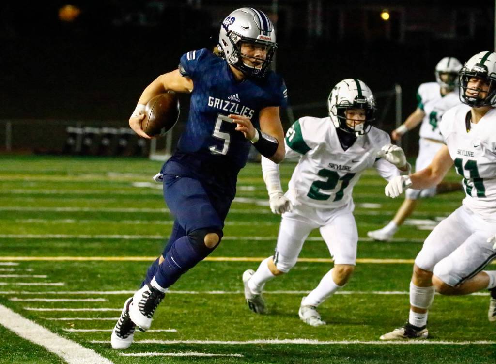 Glacier Peaks River Lien strides the sideline against Skylines defense Friday night at Veterans Memorial Stadium in Snohomish on November 5, 2021. (Kevin Clark / The Herald)