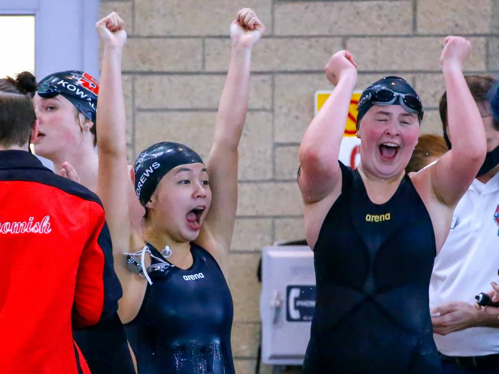 Members of the Snohomishs 200 yard medley relay team cheer their first place finish in the 3A District Championships Saturday afternoon the at the Snohomish Aquatic Center on November 6, 2021. (Kevin Clark / The Herald)