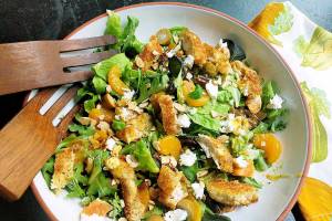 This warm arugula salad delivers a satisfying mix of pan-fried chicken tenders, fresh orange, olives and goat cheese in a warm citrus dressing, with a toasted almond garnish for crunch. (Gretchen McKay/Pittsburgh Post-Gazette/TNS)