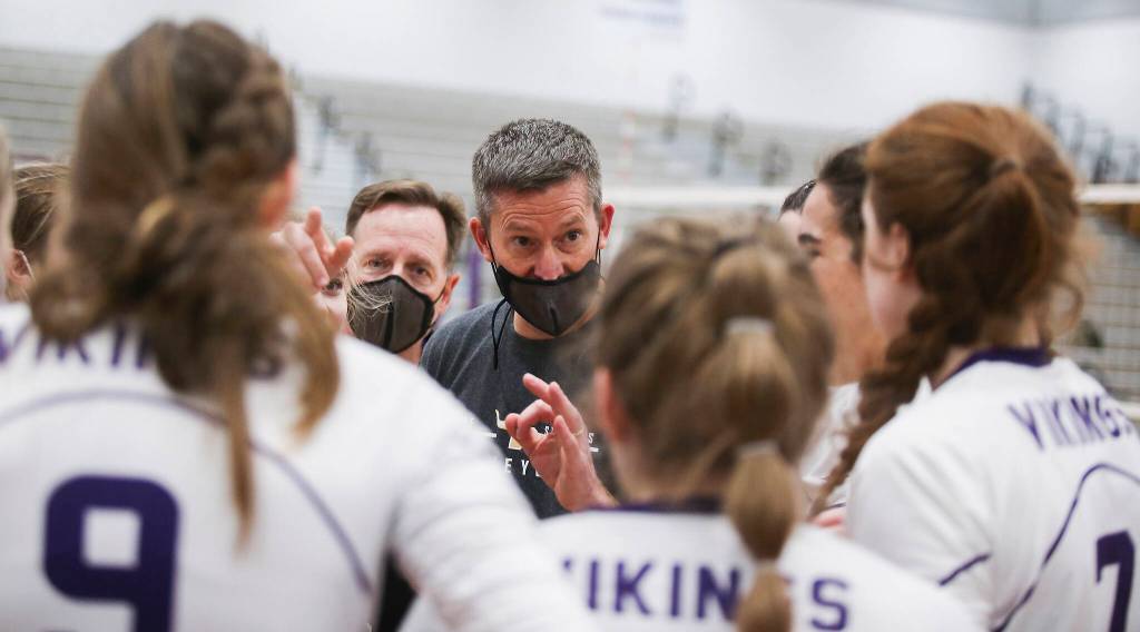 Lake Stevens head coach Kyle Hoglund gives his team advice before the start of the fifth game. (Andy Bronson / The Herald)