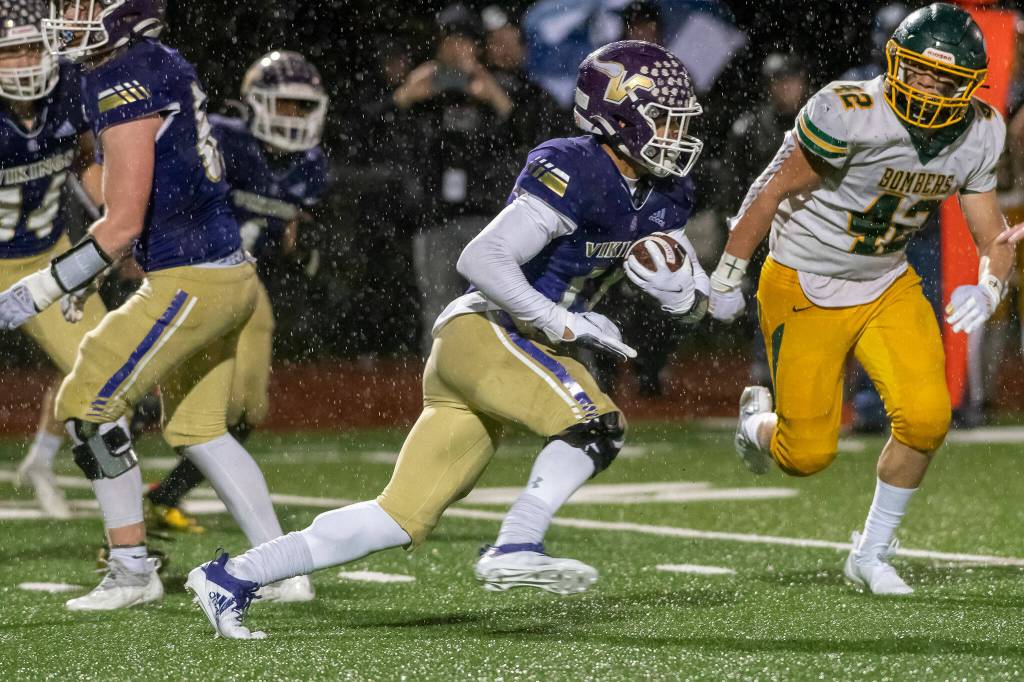 Lake Stevens running back Jayden Limar carries the ball during a 4A state playoff game against Richland on Saturday, Nov. 13, 2021 in Lake Stevens. (John Gardner / Pro Action Image)